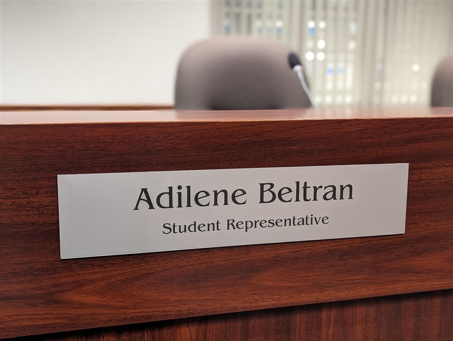 GIPS Board Room name plate reading:  Adilene Beltran, Student Representative